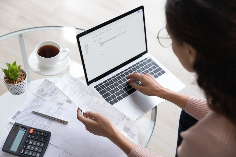 Woman calculating expenses cost by immersion cooling.